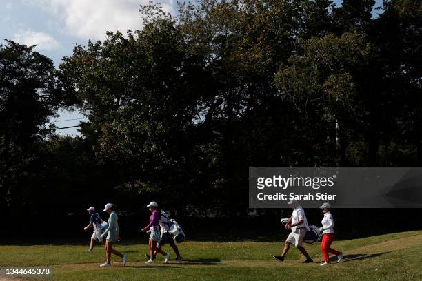 Sei Young Kim of Korea, Maria Fassi of Mexico, and Jaye Marie Green of the United States walk to the 18th fairway during the final round of the...