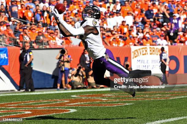 Marquise Brown of the Baltimore Ravens makes a touchdown reception in the second quarter against the Denver Broncos at Empower Field At Mile High on...