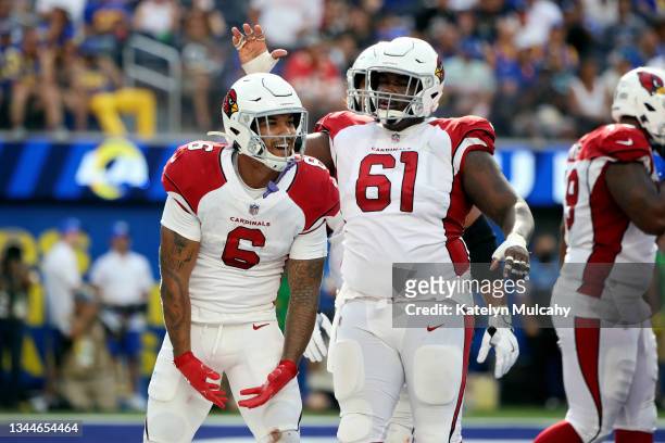 James Conner of the Arizona Cardinals celebrates a touchdown with Rodney Hudson of the Arizona Cardinals during the third quarter in the game against...