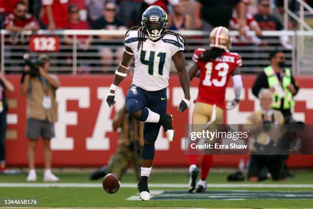 Alex Collins of the Seattle Seahawks celebrates after running for a touchdown during the fourth quarter against the San Francisco 49ers at Levi's...