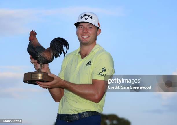 Sam Burns poses with the trophy after winning during the final round of the Sanderson Farms Championship at Country Club of Jackson on October 03,...