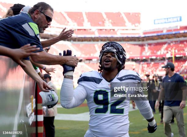 Robert Nkemdiche of the Seattle Seahawks celebrates with fans after defeating the San Francisco 49ers 28-21 at Levi's Stadium on October 03, 2021 in...