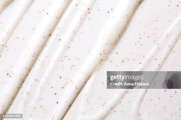 texture of white body scrub with exfoliating particles. flat lay style - glace texture imagens e fotografias de stock