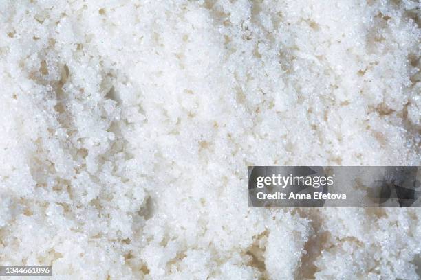 sugar scrub with coconut flakes and oil on white background. concept of body care. flat lay style - coco rallado fotografías e imágenes de stock