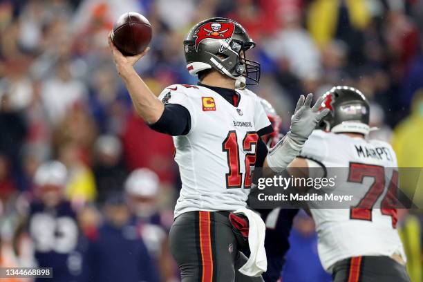 Tom Brady of the Tampa Bay Buccaneers throws a pass to break the record for career passing yards against the New England Patriots during the first...