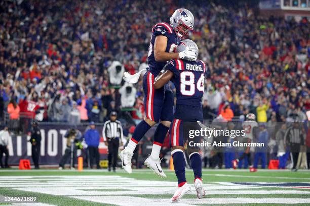 Hunter Henry of the New England Patriots celebrates with Kendrick Bourne after scoring a touchdown against the Tampa Bay Buccaneers during the second...