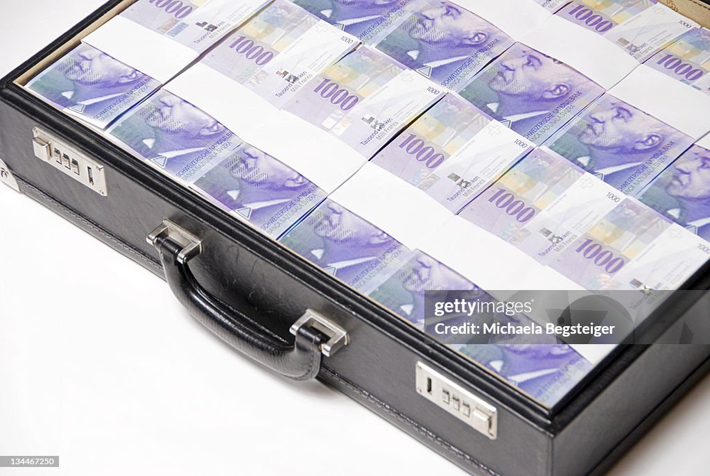 Briefcase full of Swiss francs, bills