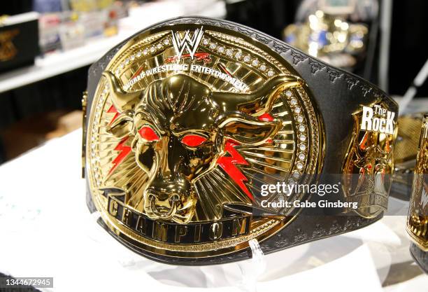 Replica of Dwayne "The Rock" Johnson's WWE brahma bull heavyweight championship belt is displayed in the Wrestling Revolution booth during Unicon...