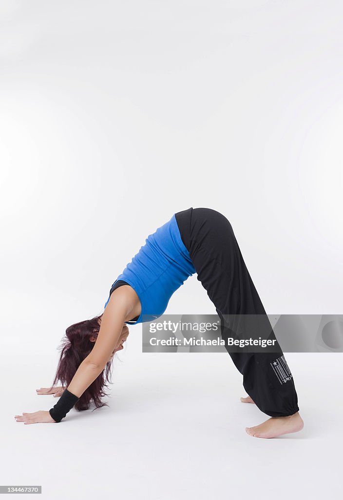 Woman doing yoga excercise, 'dog
