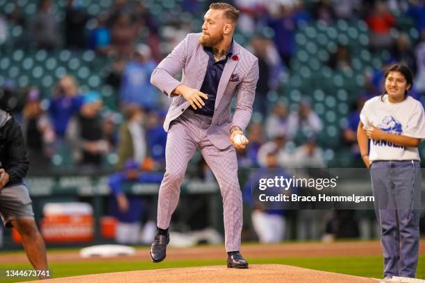 Conor McGregor throws out a ceremonial first pitch prior to the game between the Minnesota Twins and Chicago Cubs on September 21, 2021 at Wrigley...