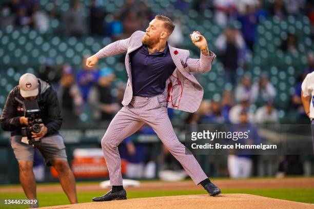 Conor McGregor throws out a ceremonial first pitch prior to the game between the Minnesota Twins and Chicago Cubs on September 21, 2021 at Wrigley...