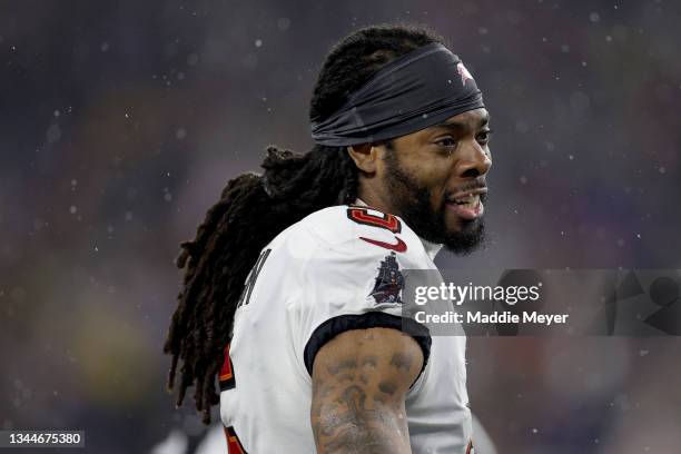 Richard Sherman of the Tampa Bay Buccaneers looks on against the New England Patriots during the second quarter in the game at Gillette Stadium on...