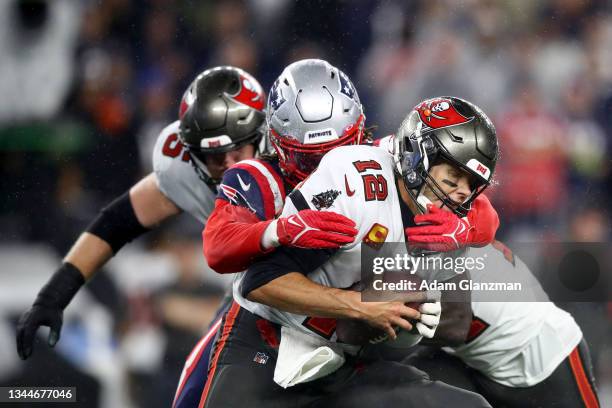 Matt Judon of the New England Patriots sacks Tom Brady of the Tampa Bay Buccaneers during the second quarter in the game at Gillette Stadium on...