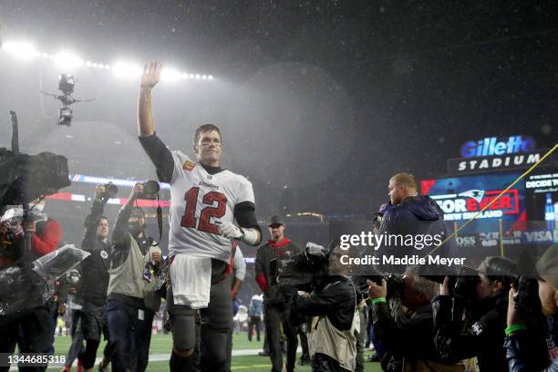 Tom Brady of the Tampa Bay Buccaneers waves to the crowd as he runs off the field after defeating the New England Patriots in the game at Gillette...