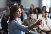 Shot of a businesswoman delivering a presentation at a conference