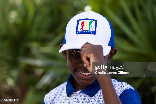 Contestent poses for a photo during The Drive, Chip and Putt Championship at The Bear's Club on October 03, 2021 in Jupiter, Florida.