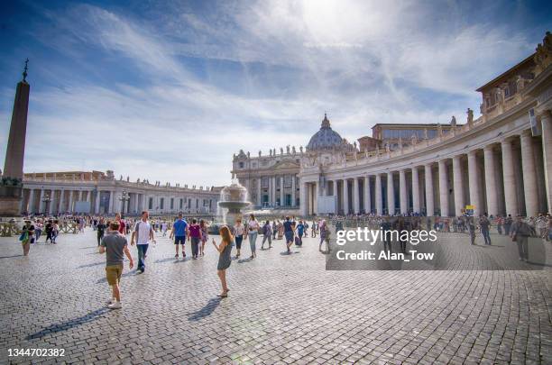 people walking of saint peter's basilica and square in vatican city - basilika stock pictures, royalty-free photos & images