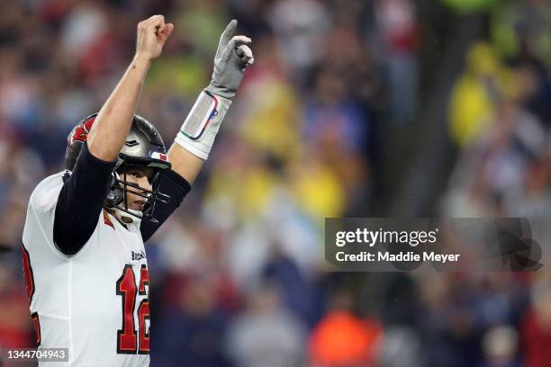 Tom Brady of the Tampa Bay Buccaneers celebrates a touchdown against the New England Patriots during the third quarter in the game at Gillette...