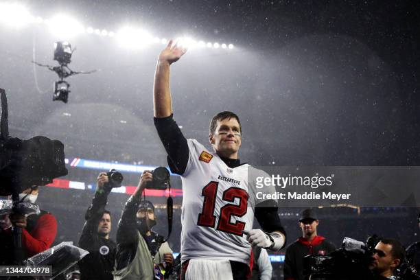 Tom Brady of the Tampa Bay Buccaneers waves to the crowd as he runs off the field after defeating the New England Patriots in the game at Gillette...