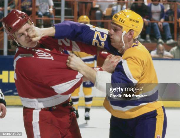 Ken Baumgartner from Canada and Defenseman for the Los Angeles King lands a right hand punch into the face of Bob Probert, Right Wing for the Detroit...