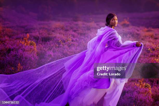 beautiful black female fantasy princess in a rural heather fairytale setting - fashion for peace stock pictures, royalty-free photos & images