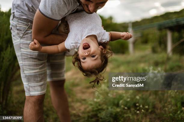 father's love - girl upside down stock pictures, royalty-free photos & images