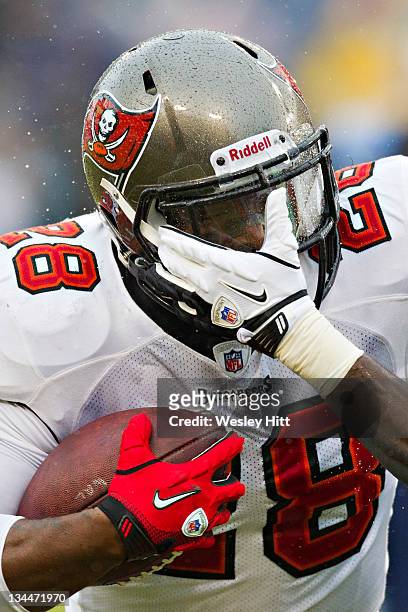 Kregg Lumpkin of the Tampa Bay Buccaneers runs the ball against the Tennessee Titans at LP Field on November 27, 2011 in Nashville, Tennessee. The...
