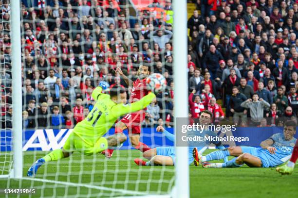 Mohamed Salah of Liverpool scores to make it 2-1 during the Premier League match between Liverpool and Manchester City at Anfield on October 03, 2021...