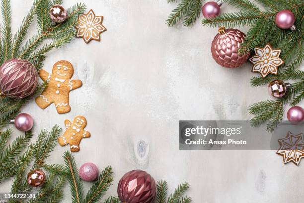 table with christmas composition with gift, decorations, fir tree branches on wooden background. flat lay, top view - plant part imagens e fotografias de stock