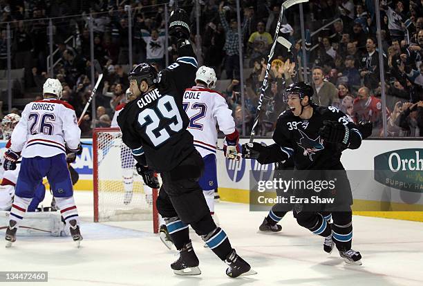 Ryane Clowe and Logan Couture of the San Jose Sharks celebrate after Clowe scored the tying goal in the third period of their game against the...