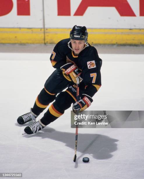 Dan Quinn from Canada, Captain and Center for the Vancouver Canucks in motion on the ice during the NHL Clarence Campbell Conference, Smythe Division...