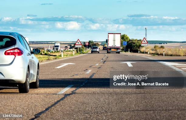 car point of view driving. car overtaking on a highway. - thoroughfare stock pictures, royalty-free photos & images