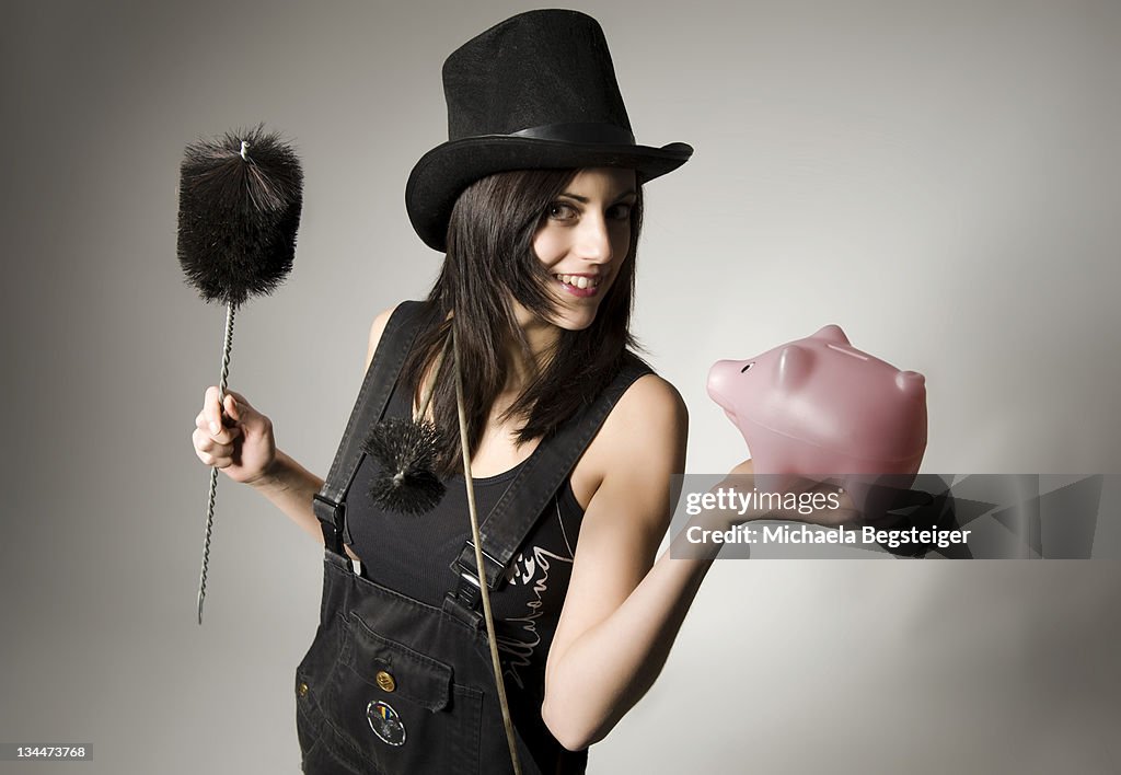 Female chimney sweep with small pig, lucky charms