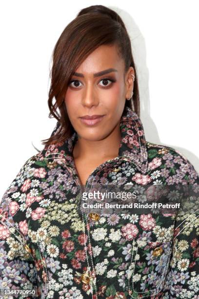 Amel Bent attends the Giambattista Valli Womenswear Spring/Summer 2022 show as part of Paris Fashion Week on October 04, 2021 in Paris, France.