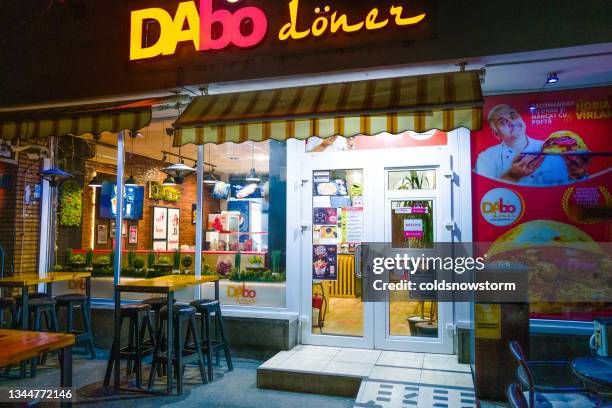 exterior of fast food kebab restaurant at night - kebab stock pictures, royalty-free photos & images