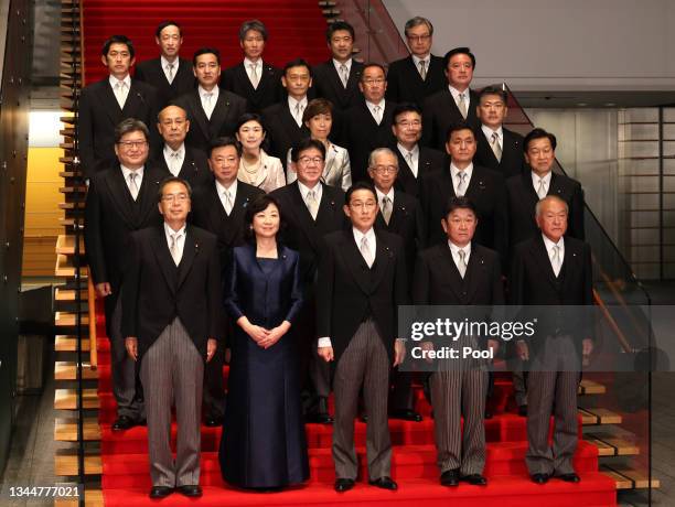 Newly elected Prime Minister Fumio Kishida arrives with his cabinet members at a photo session at the prime minister's official residence in Tokyo on...