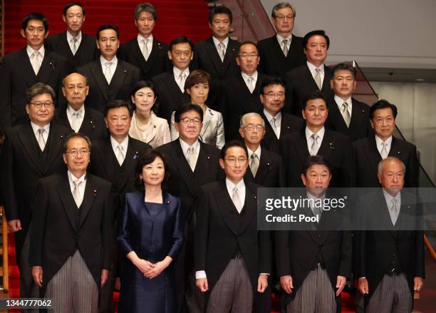 Newly elected Prime Minister Fumio Kishida arrives with his cabinet members at a photo session at the prime minister's official residence in Tokyo on...