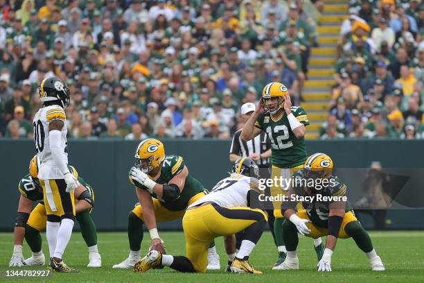 Aaron Rodgers of the Green Bay Packers waits for the snap during a game against the Pittsburgh Steelers at Lambeau Field on October 03, 2021 in Green...