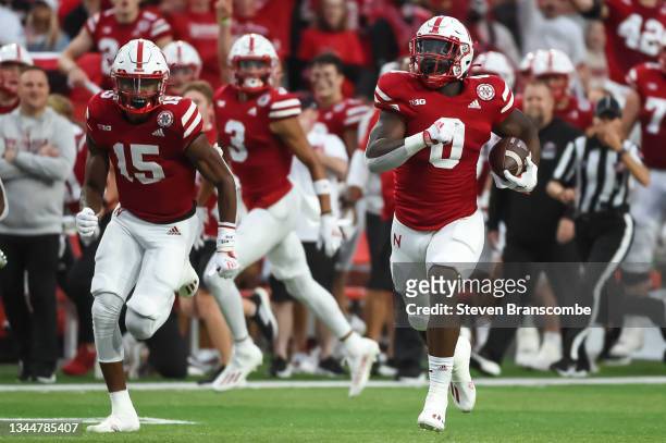 Running back Jaquez Yant of the Nebraska Cornhuskers runs with wide receiver Zavier Betts against the Northwestern Wildcats in the first half at...