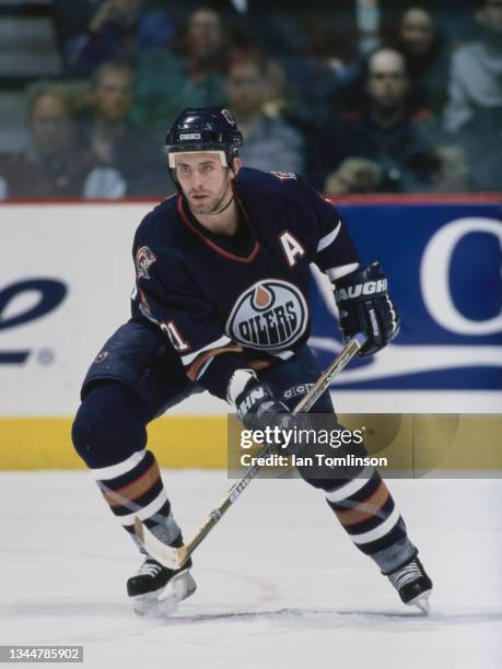 Jason Smith from Canada and Defenseman for the Edmonton Oilers in motion on the ice during the NHL Pre Season game against the Calgary Flames on 24th...