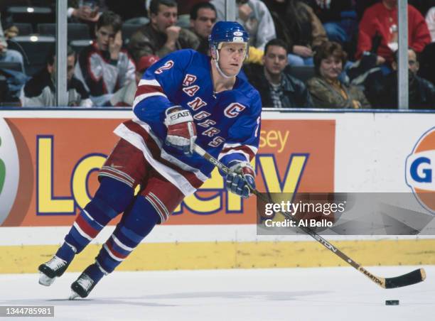 Brian Leetch, Captain and Defenseman for the New York Rangers in motion on the ice during the NHL Eastern Conference Atlantic Division game against...