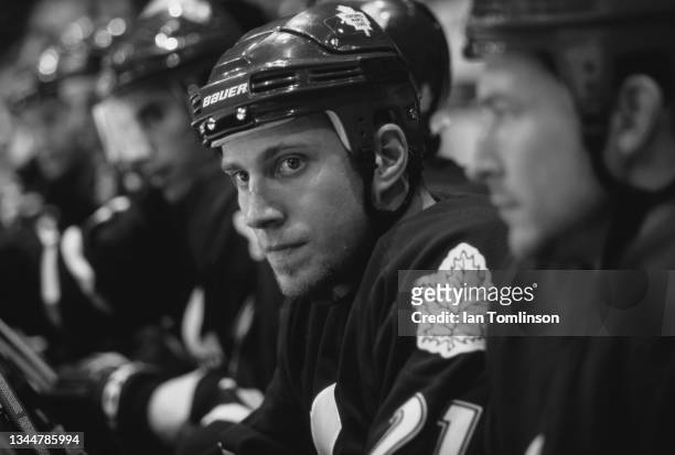 This image has been converted to black and white) Adam Mair from Canada and Center for the Toronto Maple Leafs looks on from the bench during the NHL...