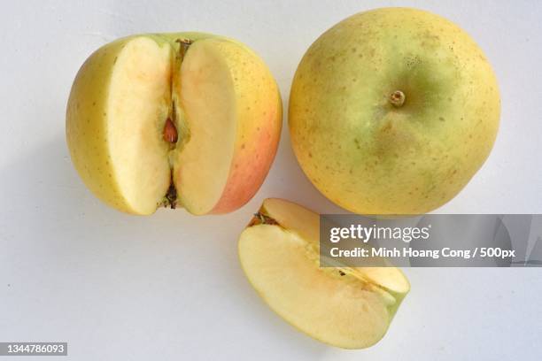 directly above shot of pears on table,montcaret,france - cutting green apple stock pictures, royalty-free photos & images