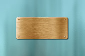 Blank golden name plate on glass background