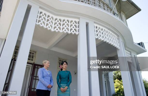 Pro-democracy opposition leader Aung San Suu Kyi and US Secretary of State Hillary Clinton speak after meetings at Suu Kyi's residence in Yangon,...