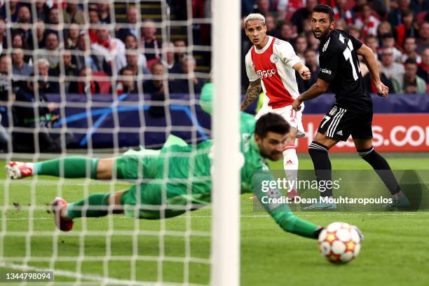 Antony of Ajax shoots past Goalkeeper, Ersin Destanoglu of Besiktas during the UEFA Champions League group C match between AFC Ajax and Besiktas at...