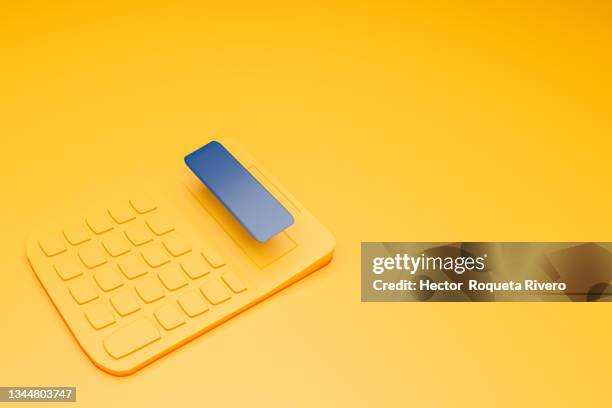 3d yellow calculator on yellow background - finance icons isolated stock-fotos und bilder