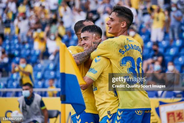 Alberto Moleiro of UD Las Palmas celebrates his first goal with his teammates during the LaLiga Smartbank match between UD Las Palmas and UD Ibiza