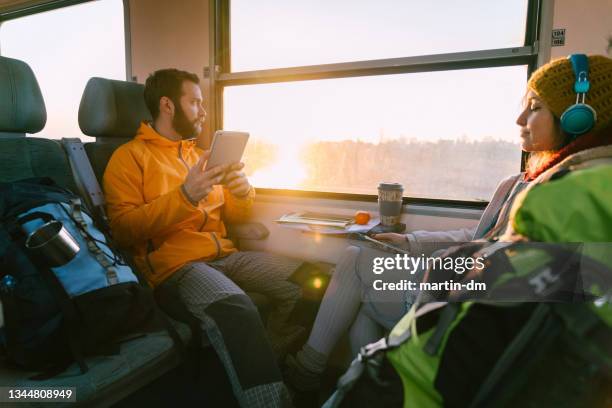 couple traveling with train - vacation train stock pictures, royalty-free photos & images