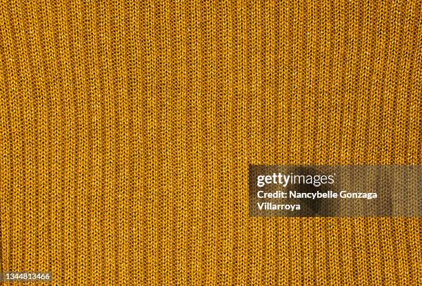 gold coloured knitted fabric - acrylic fiber 個照片及圖片檔